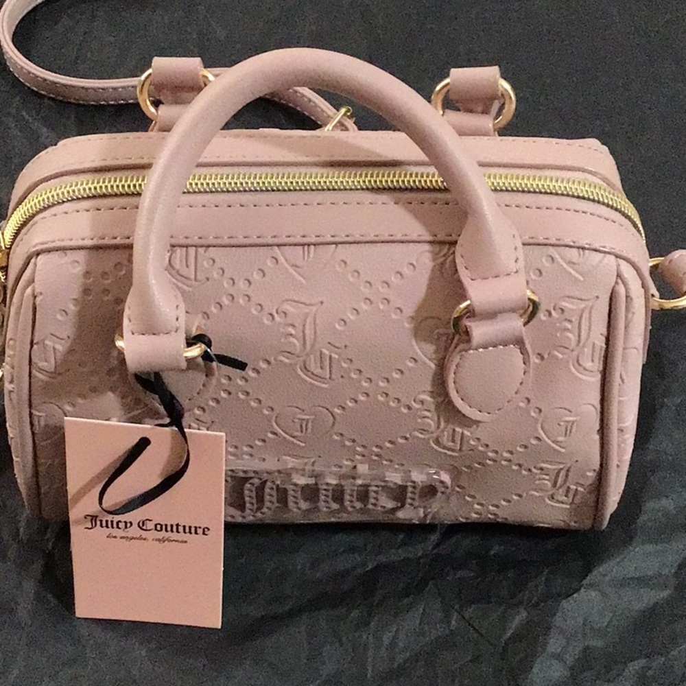 Juicy Couture light dusty pink mini satchel purse with adjustable strap. JC logo